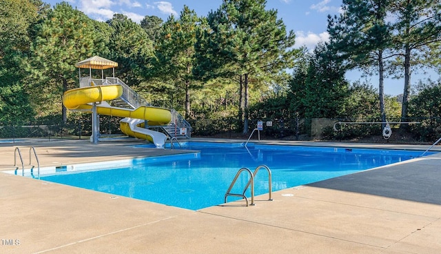 347 Country Mill Way, Fuquay Varina, NC 27526 - community pool featuring a water slide and view of wooded area