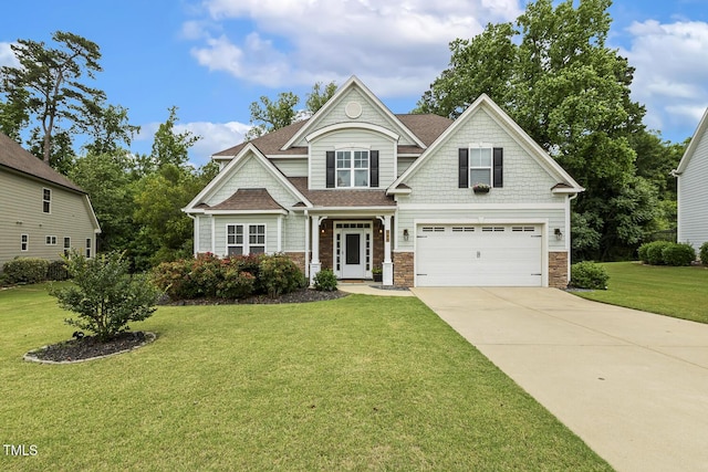 347 Country Mill Way, Fuquay Varina, NC 27526 - craftsman house with concrete driveway, an attached garage, a front lawn, roof with shingles, and stone siding