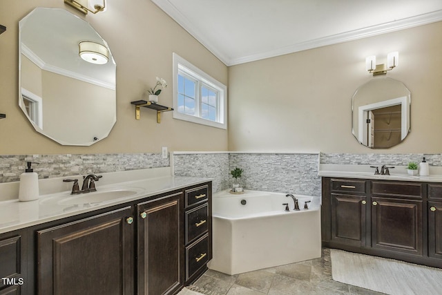347 Country Mill Way, Fuquay Varina, NC 27526 - bathroom featuring crown molding, two vanities, a garden tub, tile walls, and wainscoting