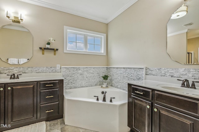 347 Country Mill Way, Fuquay Varina, NC 27526 - bathroom featuring crown molding, two vanities, and a garden tub