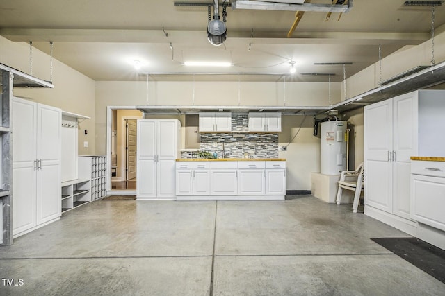 347 Country Mill Way, Fuquay Varina, NC 27526 - garage with water heater and a garage door opener