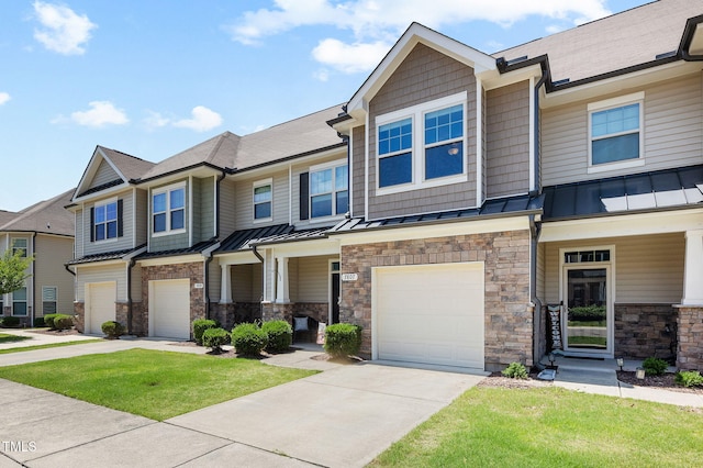 7807 Elmshire Way, Raleigh, NC 27616 - view of front facade featuring a standing seam roof, an attached garage, and driveway