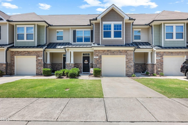 7807 Elmshire Way, Raleigh, NC 27616 - view of property with a standing seam roof, a garage, driveway, and a front yard