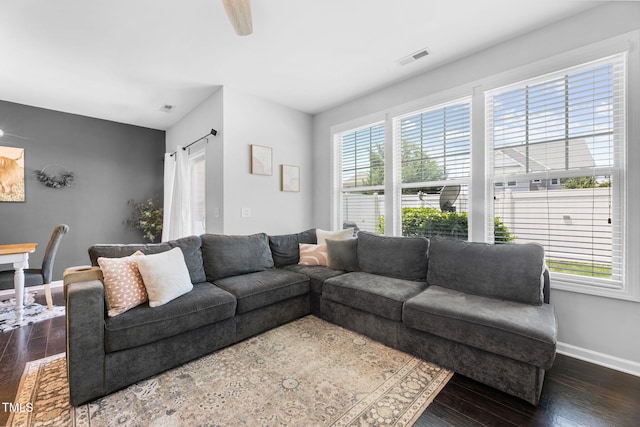 7807 Elmshire Way, Raleigh, NC 27616 - living room featuring plenty of natural light, baseboards, and dark wood-type flooring