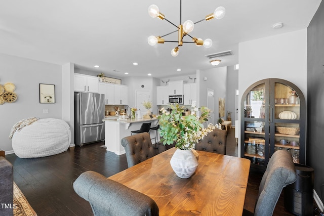 7807 Elmshire Way, Raleigh, NC 27616 - dining area featuring a chandelier, dark wood-style floors, recessed lighting, and baseboards
