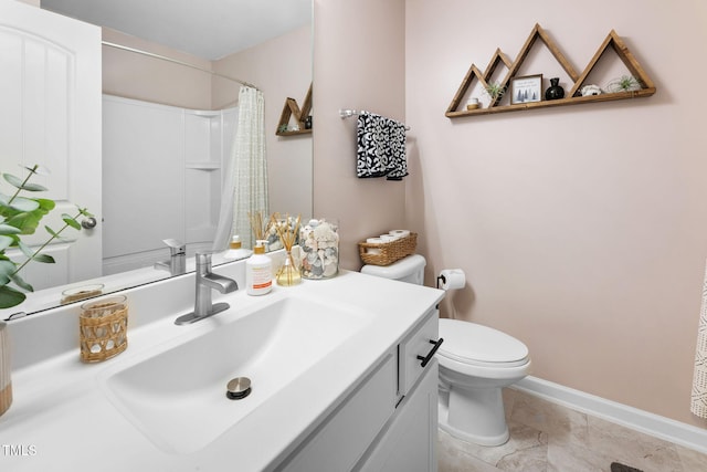 7807 Elmshire Way, Raleigh, NC 27616 - full bathroom with toilet, vanity, a shower with curtain, baseboards, and marble finish floors