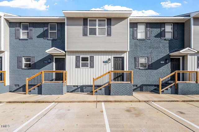 391 E Williams St, Angier, NC 27501 - multi unit property featuring uncovered parking and board and batten siding