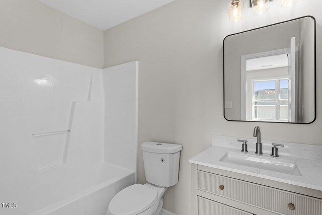 391 E Williams St, Angier, NC 27501 - bathroom featuring vanity, toilet, and shower / washtub combination