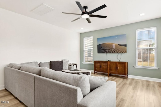 116 Hayfield Dr, Lillington, NC 27546 - living room featuring a ceiling fan, light wood-style floors, baseboards, recessed lighting, and plenty of natural light