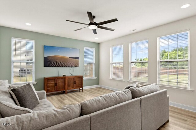 116 Hayfield Dr, Lillington, NC 27546 - living area with light wood finished floors, ceiling fan, baseboards, healthy amount of natural light, and recessed lighting