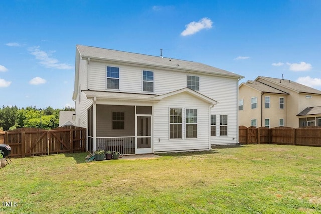116 Hayfield Dr, Lillington, NC 27546 - rear view of house with a gate and a sunroom