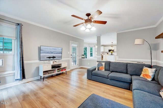 113 Fetzer Ct, Cary, NC 27513 - living area with light wood-style floors, ceiling fan, ornamental molding, and baseboards