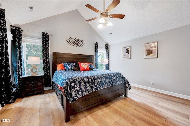113 Fetzer Ct, Cary, NC 27513 - bedroom with light wood finished floors, high vaulted ceiling, baseboards, and ceiling fan