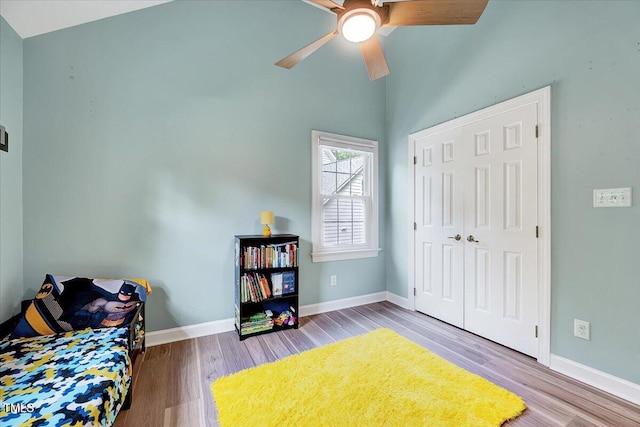 113 Fetzer Ct, Cary, NC 27513 - bedroom featuring wood finished floors, high vaulted ceiling, baseboards, and ceiling fan