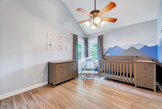 113 Fetzer Ct, Cary, NC 27513 - bedroom featuring lofted ceiling, light wood-style flooring, a crib, baseboards, and ceiling fan