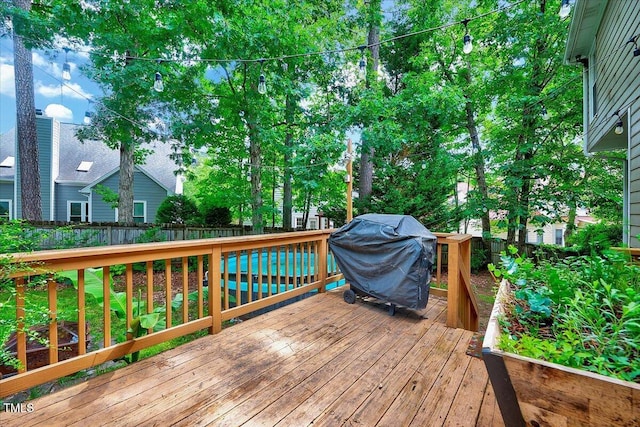 113 Fetzer Ct, Cary, NC 27513 - wooden deck featuring area for grilling and a fenced backyard