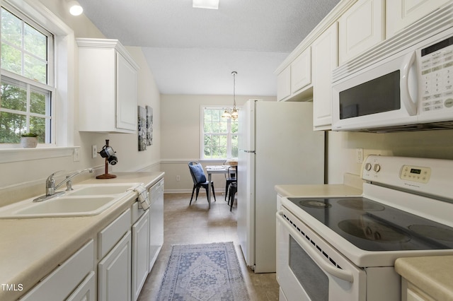 118 Setter Pt, Clayton, NC 27520 - kitchen with white appliances, a sink, white cabinets, light countertops, and baseboards
