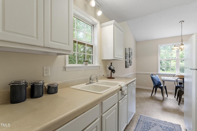 118 Setter Pt, Clayton, NC 27520 - kitchen featuring a sink, white appliances, white cabinetry, lofted ceiling, and a chandelier