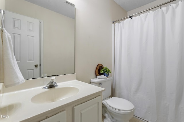 118 Setter Pt, Clayton, NC 27520 - bathroom with toilet, vanity, and a textured ceiling