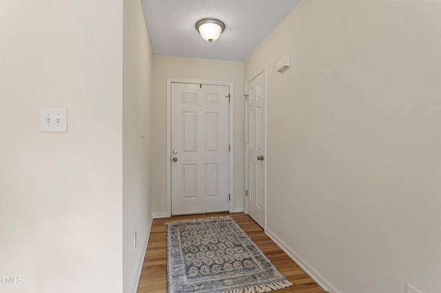 118 Setter Pt, Clayton, NC 27520 - doorway to outside featuring light wood-style floors and baseboards