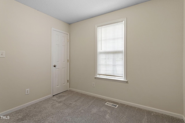 118 Setter Pt, Clayton, NC 27520 - spare room featuring carpet and baseboards