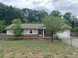 1813 Ashton Rd, Fayetteville, NC 28304 - view of front of property with a garage, driveway, and brick siding
