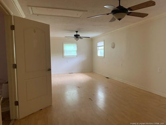 1813 Ashton Rd, Fayetteville, NC 28304 - unfurnished room with attic access, a ceiling fan, ornamental molding, light wood finished floors, and baseboards