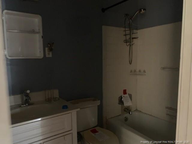 1813 Ashton Rd, Fayetteville, NC 28304 - bathroom with toilet, vanity, and shower / washtub combination