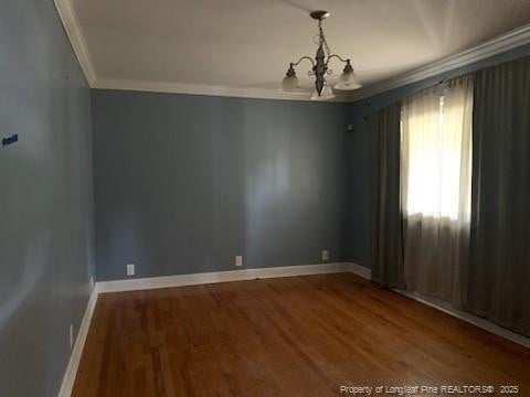 1813 Ashton Rd, Fayetteville, NC 28304 - unfurnished room featuring ornamental molding, a chandelier, wood finished floors, and baseboards