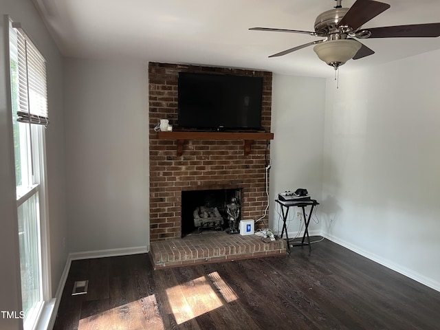 503 Pine Run, Knightdale, NC 27545 - unfurnished living room with wood finished floors, baseboards, a fireplace, and a ceiling fan