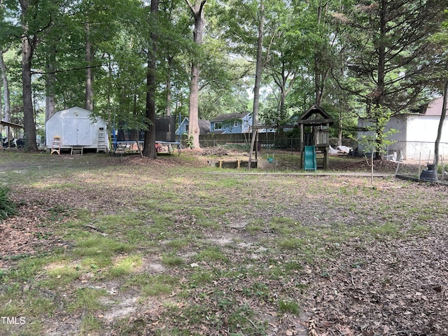 503 Pine Run, Knightdale, NC 27545 - view of yard featuring a trampoline and a playground