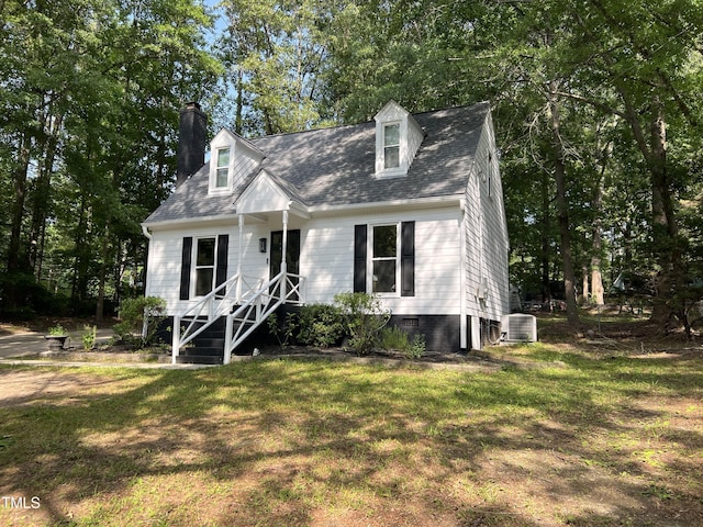 503 Pine Run, Knightdale, NC 27545 - cape cod house with a front yard, a chimney, central AC unit, and a shingled roof