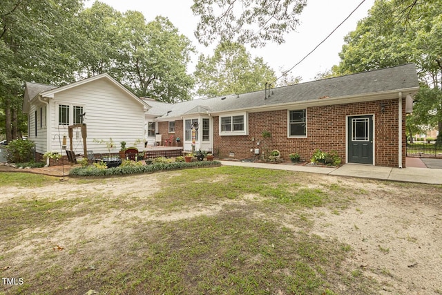 6517 Whitted Rd, Fuquay Varina, NC 27526 - back of house featuring brick siding, a patio area, a yard, and a shingled roof