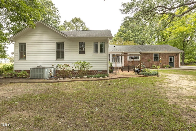 6517 Whitted Rd, Fuquay Varina, NC 27526 - rear view of house with cooling unit, a lawn, a patio, and crawl space