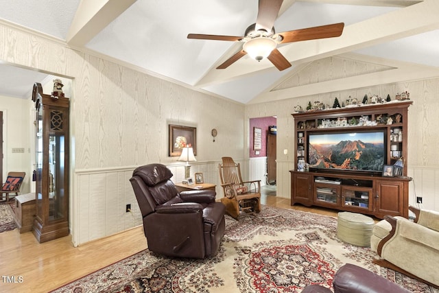 6517 Whitted Rd, Fuquay Varina, NC 27526 - living area with lofted ceiling, wood finished floors, a ceiling fan, and wainscoting