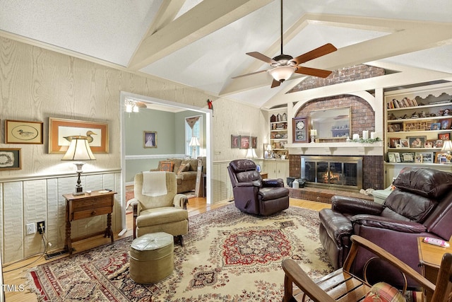 6517 Whitted Rd, Fuquay Varina, NC 27526 - living area with wood finished floors, ceiling fan, built in features, and a wainscoted wall