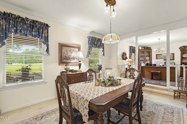6517 Whitted Rd, Fuquay Varina, NC 27526 - dining area with crown molding, carpet floors, a chandelier, and baseboards