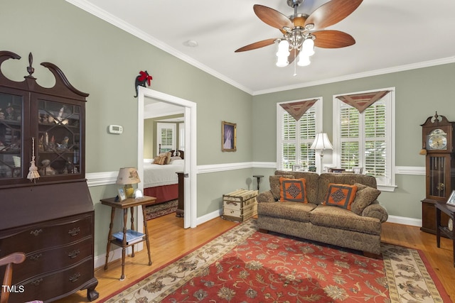 6517 Whitted Rd, Fuquay Varina, NC 27526 - living room with wood finished floors, crown molding, ceiling fan, and baseboards