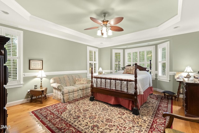 6517 Whitted Rd, Fuquay Varina, NC 27526 - bedroom featuring a raised ceiling, wood finished floors, crown molding, ceiling fan, and baseboards