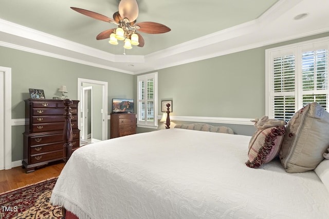 6517 Whitted Rd, Fuquay Varina, NC 27526 - bedroom with a raised ceiling, wood finished floors, ornamental molding, ceiling fan, and baseboards