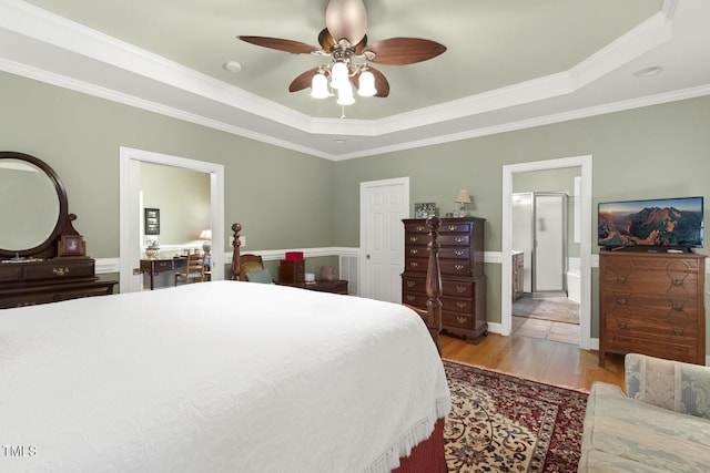 6517 Whitted Rd, Fuquay Varina, NC 27526 - bedroom with a raised ceiling, light wood-style floors, ornamental molding, ensuite bathroom, and a closet