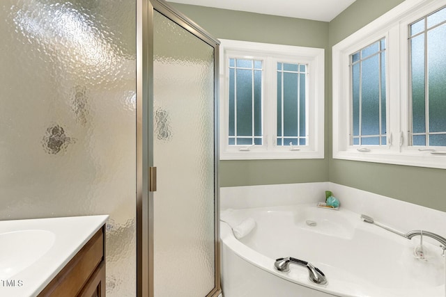 6517 Whitted Rd, Fuquay Varina, NC 27526 - bathroom with a shower stall, a bath, and vanity