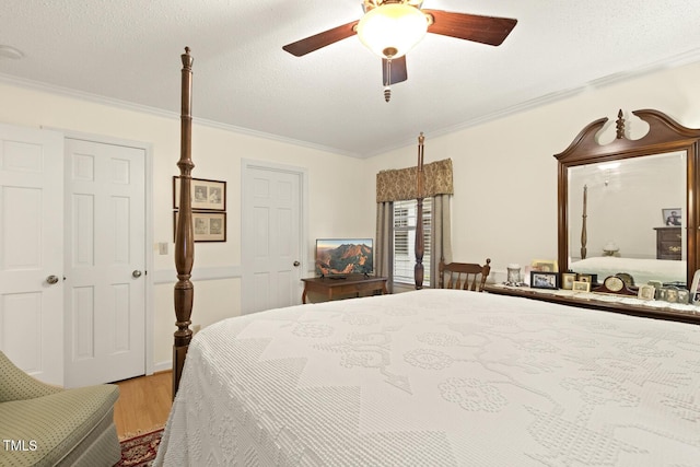 6517 Whitted Rd, Fuquay Varina, NC 27526 - bedroom with crown molding, wood finished floors, a ceiling fan, and a textured ceiling