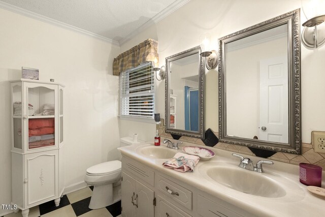 6517 Whitted Rd, Fuquay Varina, NC 27526 - bathroom with double vanity, ornamental molding, toilet, tile patterned floors, and backsplash