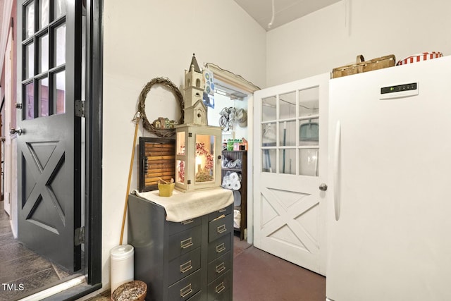 6517 Whitted Rd, Fuquay Varina, NC 27526 - kitchen with freestanding refrigerator, dark cabinetry, and concrete floors