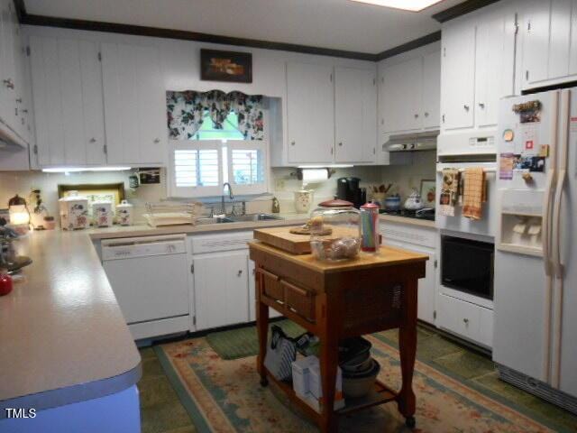 6517 Whitted Rd, Fuquay Varina, NC 27526 - kitchen with white appliances, a sink, light countertops, white cabinetry, and under cabinet range hood