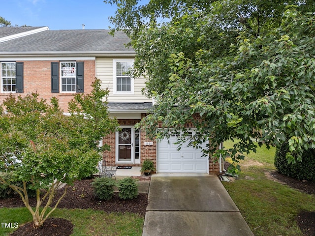 2950 Settle In Ln, Raleigh, NC 27614 - view of front of home featuring brick siding, concrete driveway, a shingled roof, and a garage