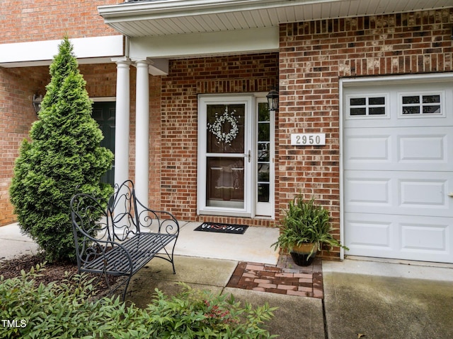 2950 Settle In Ln, Raleigh, NC 27614 - doorway to property with brick siding and an attached garage