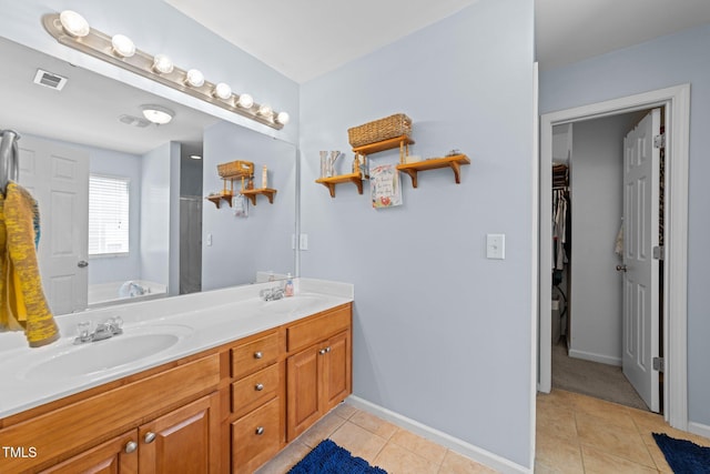 2950 Settle In Ln, Raleigh, NC 27614 - full bathroom with double vanity, tile patterned floors, a bath, and a spacious closet