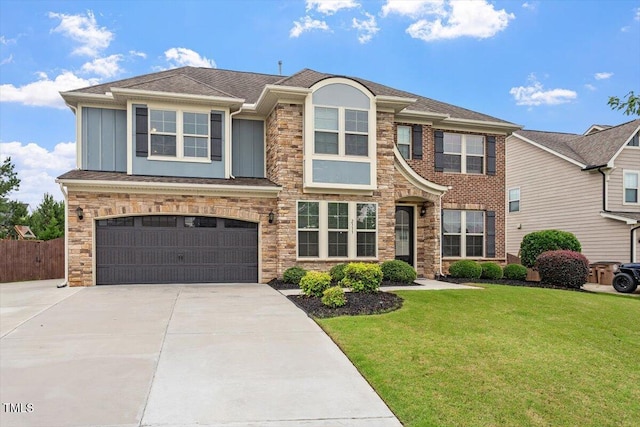 2333 Lantern Walk Ln, Wake Forest, NC 27587 - view of front of home with driveway, a garage, board and batten siding, and stone siding